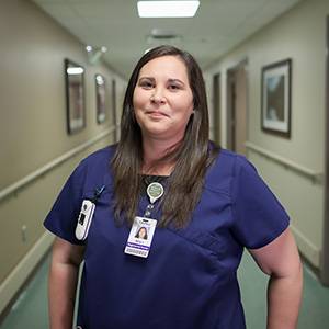 UND nurse graduate in hospital hallway