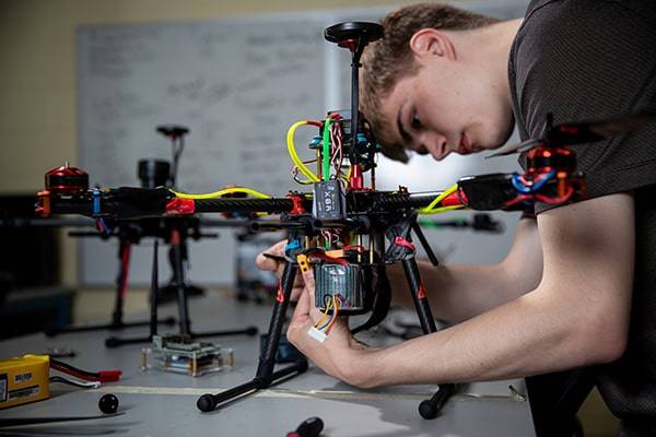 uas student working on drone